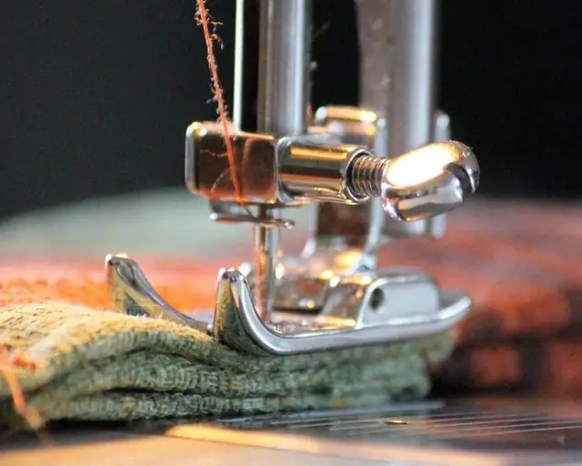 Sewing machine stitching fabric